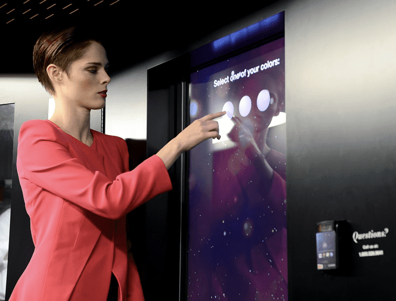 A woman using interctive digital sigange